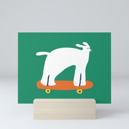 Poodle dog on skateboard Mini Art Print