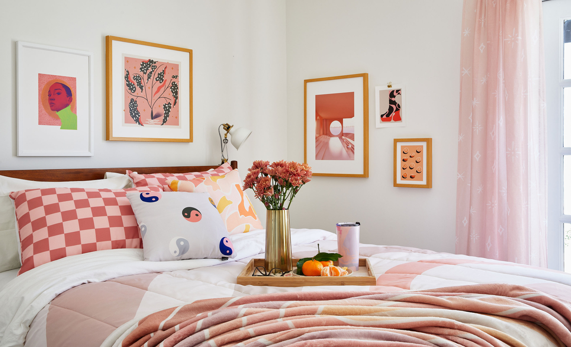 bedroom with pink bedding and decor