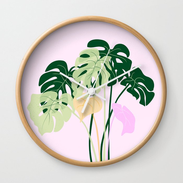 monstera plant on pink background Wall Clock