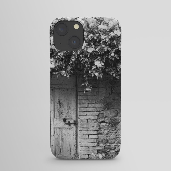 Old Italian wall overgrown with roses iPhone Case