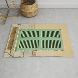 Green hatch in an old wall Rug