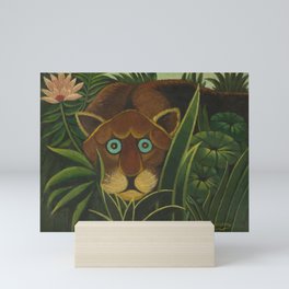 Lioness peers out of the jungle and grasses, circa 1890, oil on canvas print by Henri Rousseau Mini Art Print
