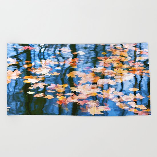 Fallen leaves in water Beach Towel