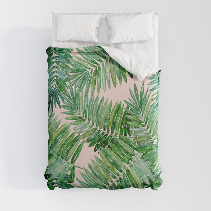 Green palm leaves on a light pink background. Duvet Cover