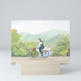 A girl cycling in Spring  Mini Art Print | River, Sunshine, Girl, Rural, Young, Cat, Painting, Path, Digital, Bright 