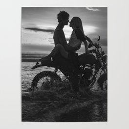 The motorcyclists; lovers at sunset on vintage motorcycle coastal beach romantic portrait black and white photograph - photography - photographs by Yuliya Kirayonak Poster