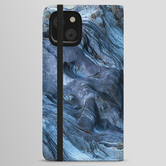 Detail of a rock with variants of blue. Rock full of curves and smooth cuts resulting from the erosive effect of sea. Close up rocks, texture dramatic and colorful erosional water formation. Stone iPhone Wallet Case