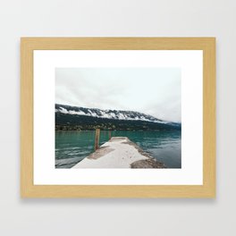 Peer to a cloudy lake, Switzerland | Landscape | Moody travel photography Framed Art Print