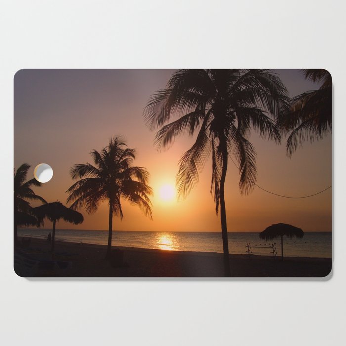 Palm trees at sunset Cutting Board