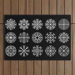 minimalist snow flakes on black Outdoor Rug