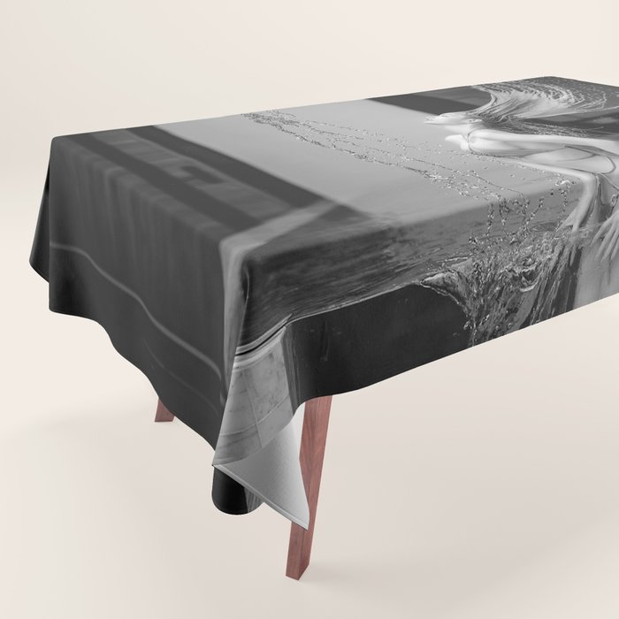 Infinity pool; female doing magical question mark water hair spalsh