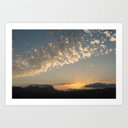 Clouds, golden sunlight and the Sierra de Bernia mountain range in Spain Art Print