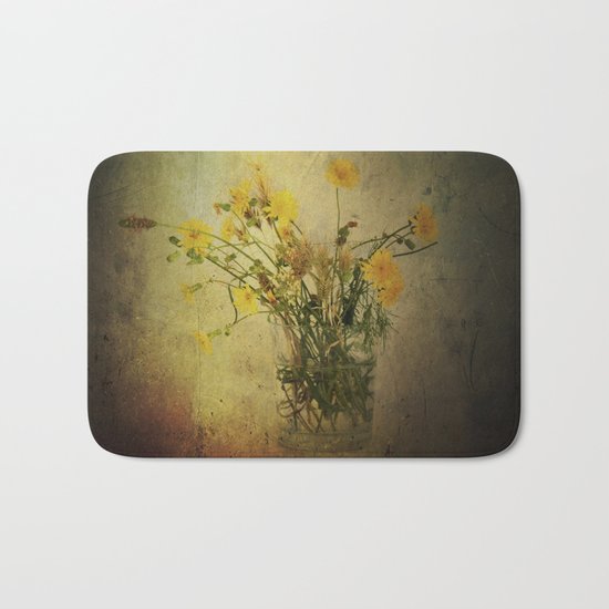 One Glass with pretty yellow weeds Bath Mat