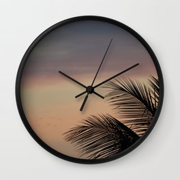 Sunrise and palm leaves Wall Clock
