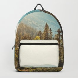 Panoramic view of nature peaceful landscape. Vintage mountains and beautiful blue sky background.  Backpack