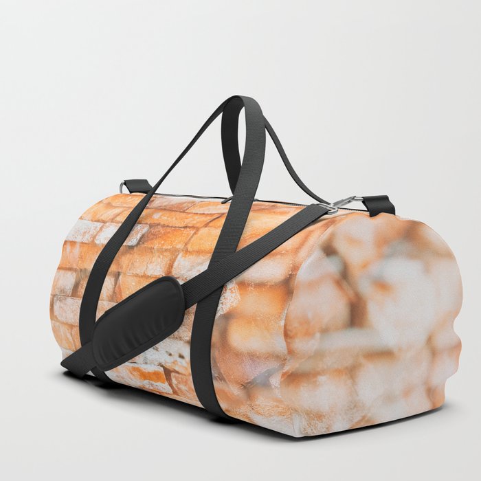 Retro style background or texture in double exposure. The stonewall from old orange bricks.  Duffle Bag