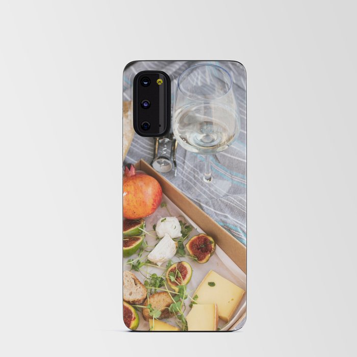 Different delicious food and glass of wine on picnic Android Card Case