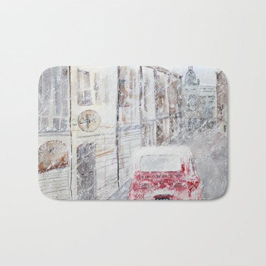 Snowfall and little red car Bath Mat
