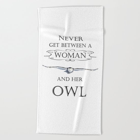Never get between a woman and her owl Beach Towel
