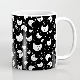 Cat heads floating on a black background Mug