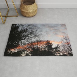 red clouds in the sky Rug