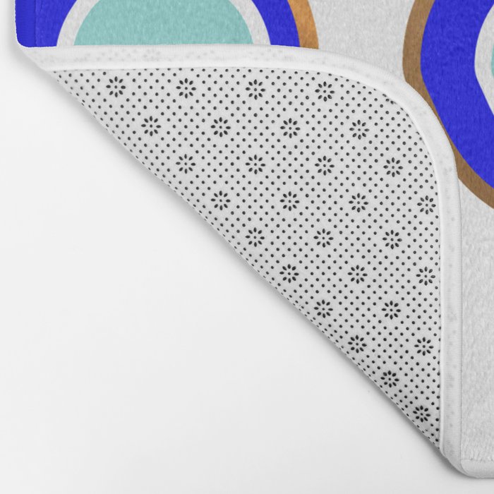 Grecian Gold evil eye in blue on white