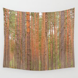 Slender tree trunks of a pine forest Wall Tapestry