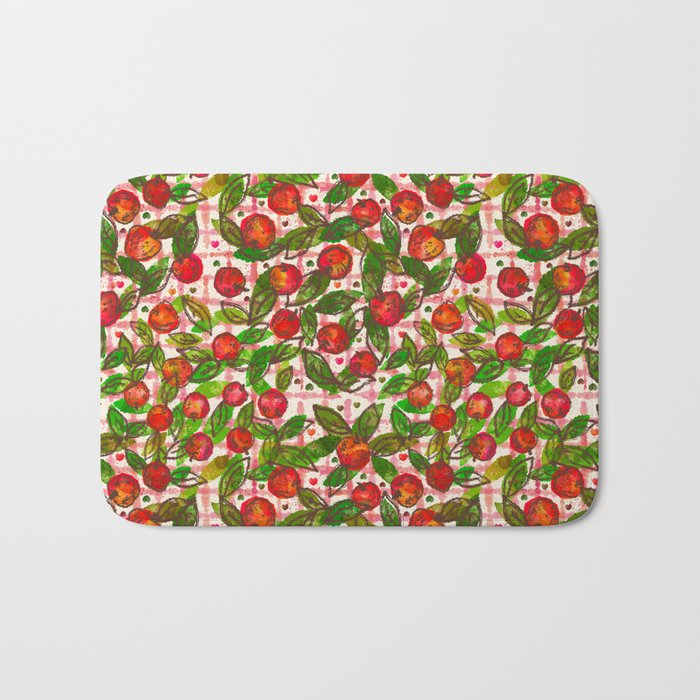 The apples and leaves seamless repeat pattern in pink gingham background Bath Mat