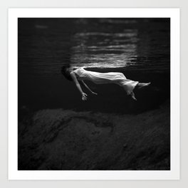 Underwater view of a woman floating in water Art Print