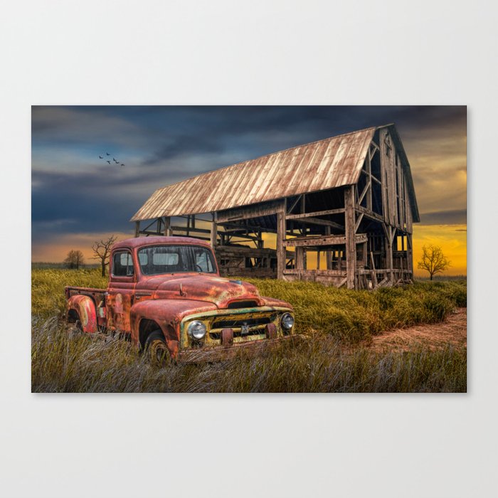 Red Pickup Truck with Weathered Barn in a Rural Landscape Canvas Print