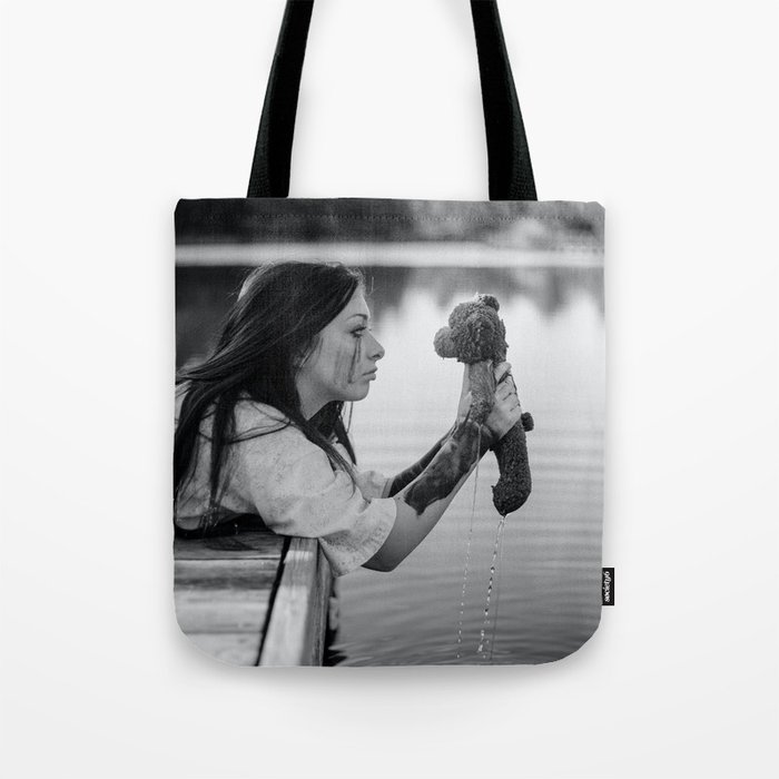 School daze; girl pulling childhood teddy bear out of lake breakup relationship female black and white photograph - photography - photographs Tote Bag