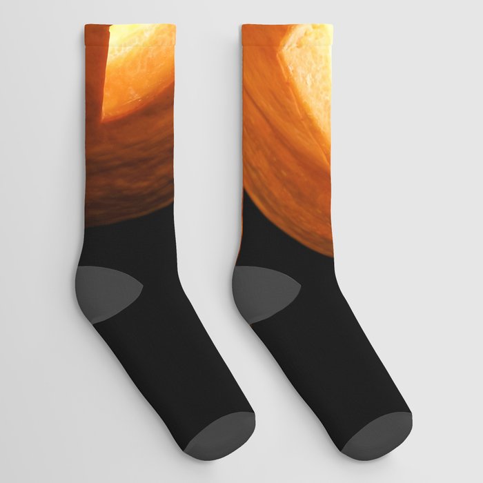Carved Pumpkin for Halloween and Autumn Leaves on Black Background Socks