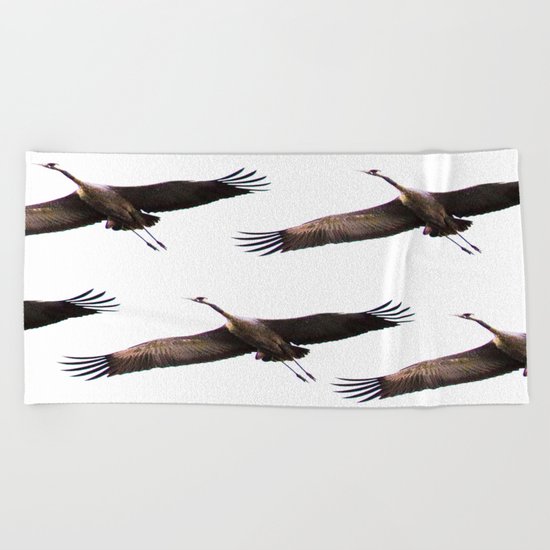 Cranes in flight Beach Towel