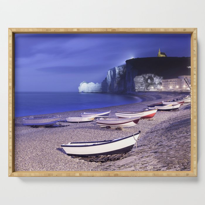 Etretat bay beach and boats on foggy night. Normandy, France. Serving Tray