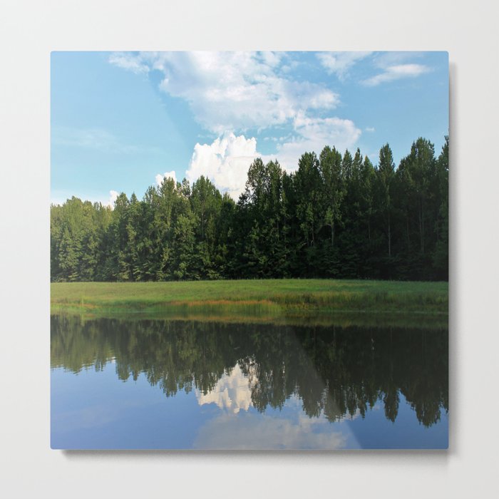 Clouds over a pond Metal Print