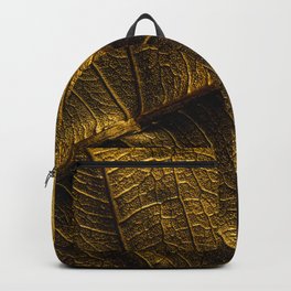 Close-up view on golden leaf from Bodhi tree. Concept of luxury to decorate. Gold-plated leaves deluxe natural illustration design. Backpack