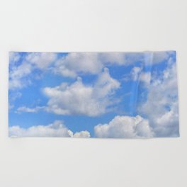Fluffy clouds blue sky sunny day Beach Towel