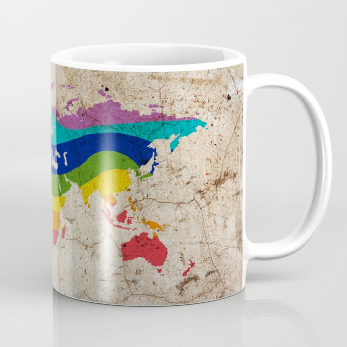 Rainbow color painted world map on dirty old grunge cement wall Coffee Mug