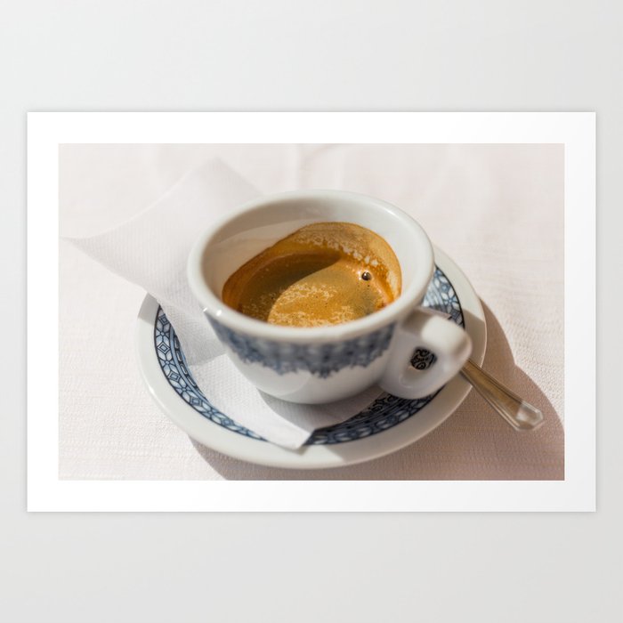 Italian espresso coffe with cream on a table outside a bar in Italy. Art Print