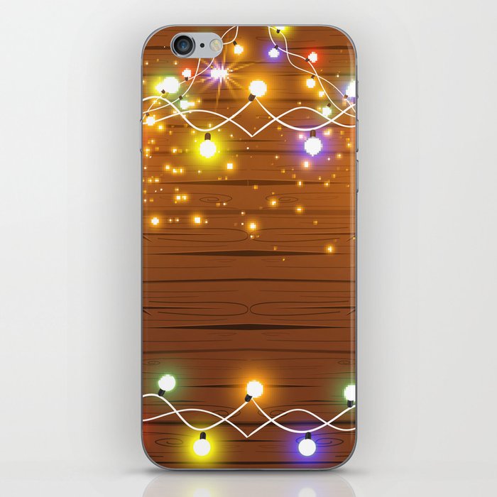 Christmas and New Year design: wooden background with Christmas lights of garland. Vintage illustration, Set of glowing christmas lights. Wooden background.  iPhone Skin