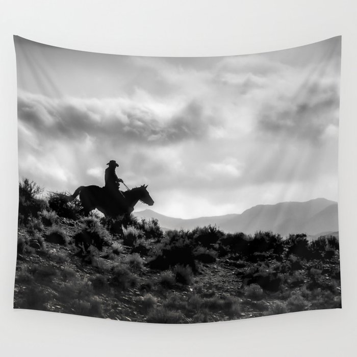 Cowboy and his horse on the valley at evening Wall Tapestry