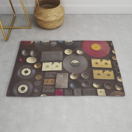 Music. Vintage wall with vinyl records and audio cassettes hung. Rug