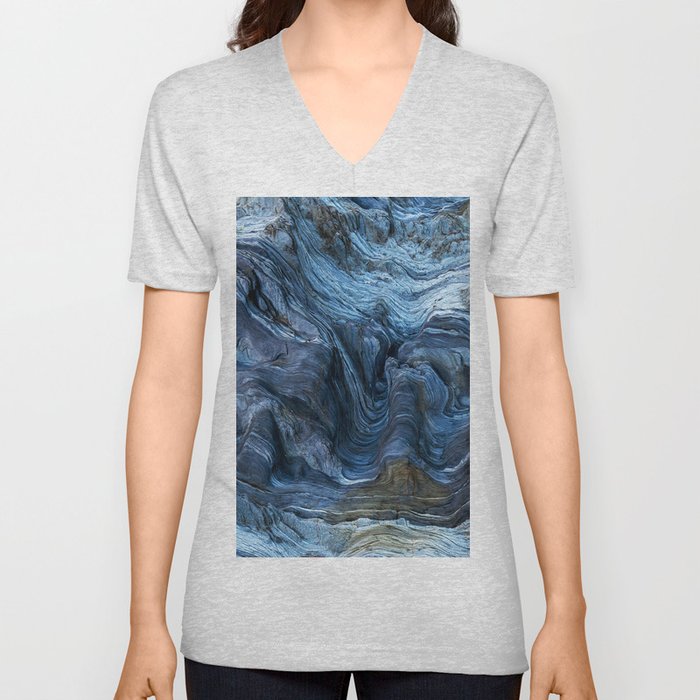 Detail of a rock with variants of blue. Rock full of curves and smooth cuts resulting from the erosive effect of sea. Close up rocks, texture dramatic and colorful erosional water formation. Stone V Neck T Shirt