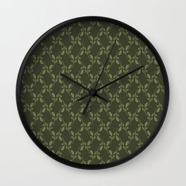Green leaves over dark green background Wall Clock