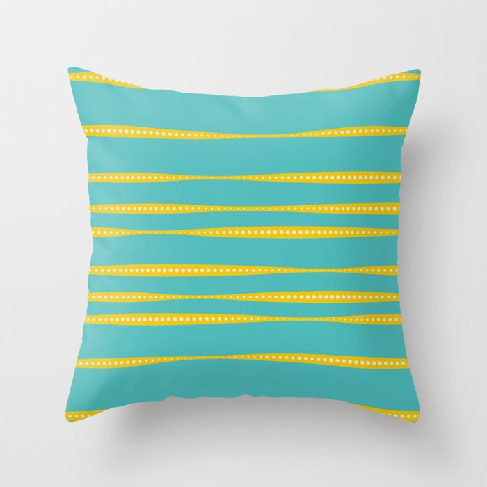 turquoise pillow with mustard yellow stripes with white dots