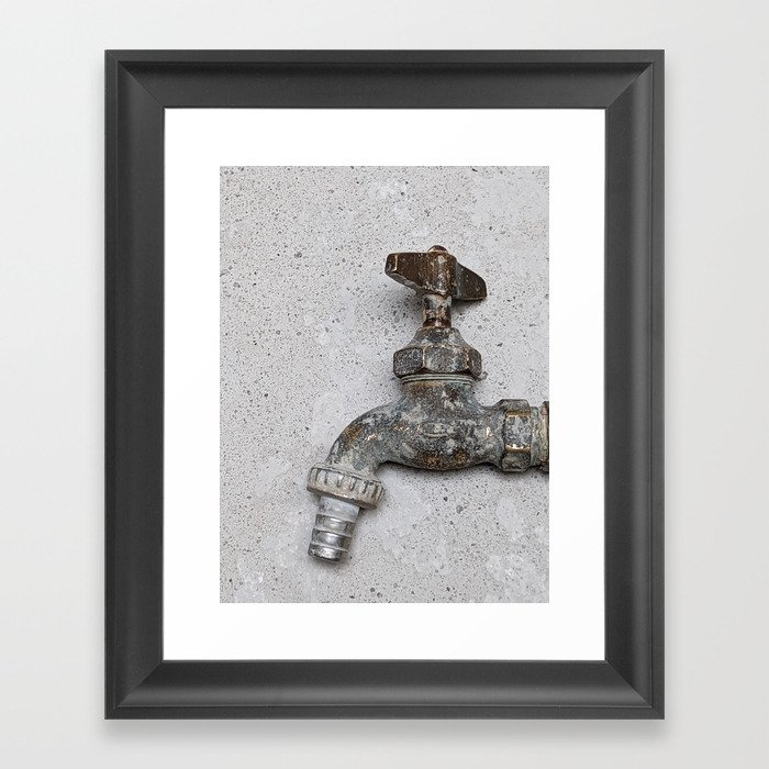 Copper water faucet over gray cement Framed Art Print