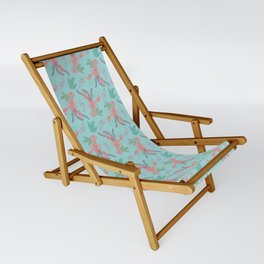 Pink lobsters under the sea with algae on blue aqua background Sling Chair