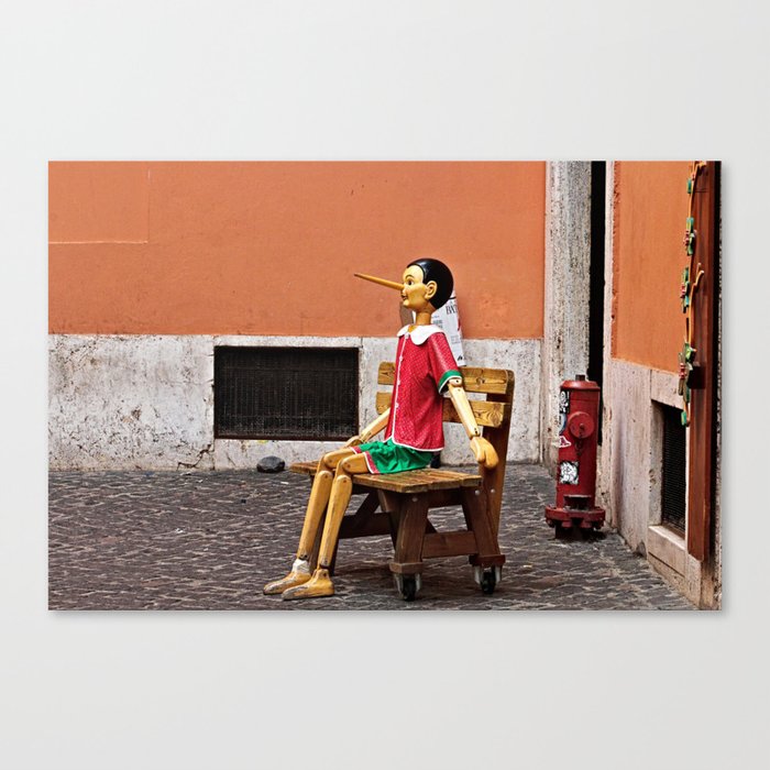 Pinocchio Marionette Sitting on Street Bench Canvas Print