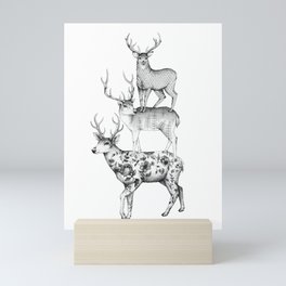 A pile of stags Mini Art Print