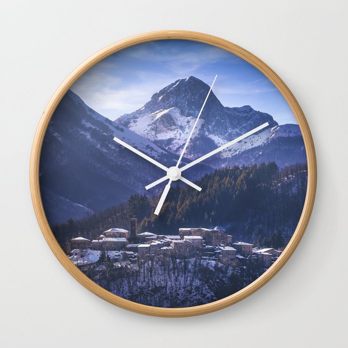 Snowy village Nicciano and Apuan mountains. Tuscany Wall Clock